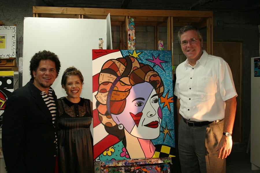 Romero Britto, Columba Bush, and Jeb Bush with a portrait of Mrs. Bush done by Britto.