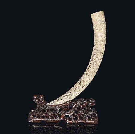 A large carved and pierced ivory tusk