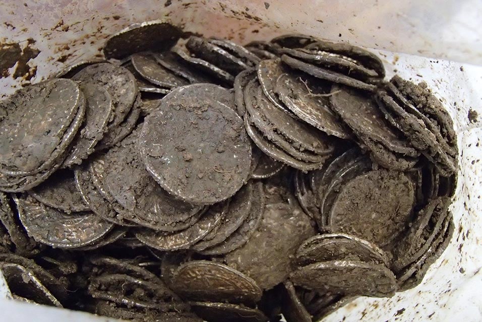 Some of the coins from the Lenborough Hoard before cleaning commenced. Photo ©the Trustees of the British Museum.