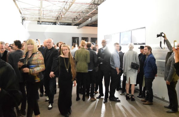 The crowd during the opening for Loris Gréaud's "The Unplayed Notes Museum," as the works were being destroyed