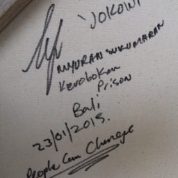 Myuran Sukumaran, signature on the back of a portrait of Indonesian President Joko Widodo.