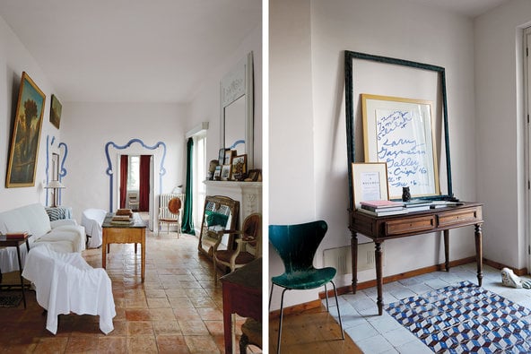 "A rarely used sitting room in the main house, where the furniture is covered in muslin sheets and an antique mirror keeps cold air from entering through the fireplace; the entryway of the house where Del Roscio now stays when he is in Gaeta, with a chair by Arne Jacobsen, 18th-century Neapolitan floor tiles and a poster for a Twombly show at Gagosian Gallery from 2008, framed with a vintage Del Roscio find." Photo: Simon Watson/T Magazine