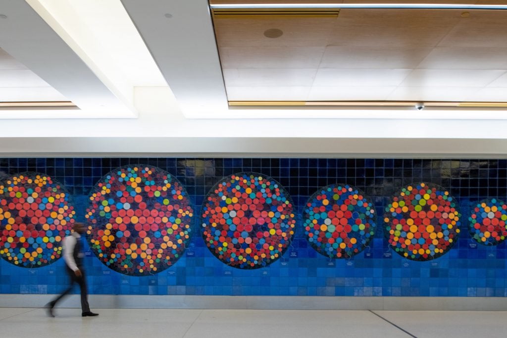 Mariam Ghani’s <em>The Worlds We Speak</em> mosaic at the baggage claim at the new terminal at LaGuardia International Airport. Photo by Chris Rank, Rank Studios