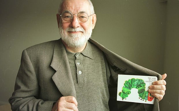 Children's book author and illustrator Eric Carle with his best-known book, The Very Hungry Caterpillar