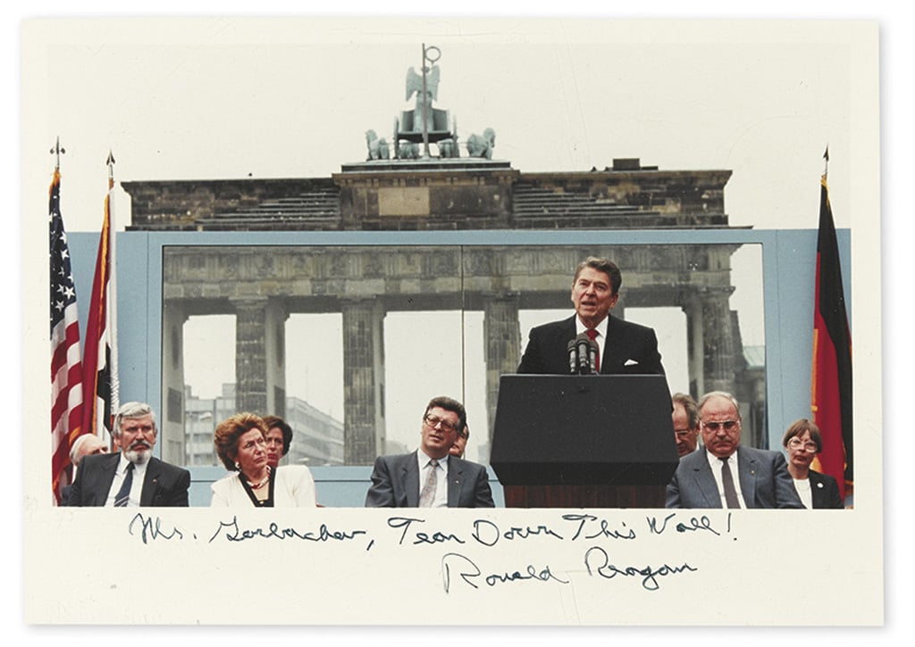 Photograph of Ronald Reagan at the Brandenburg Gate in Berlin with German officials, signed "Mr. Gorbachev, Tear Down This Wall!" Photo: Swann Galleries.