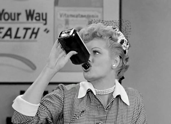 Lucille Ball drinking the intoxicating Vitameatavegamin on <em>I Love Lucy</em>.