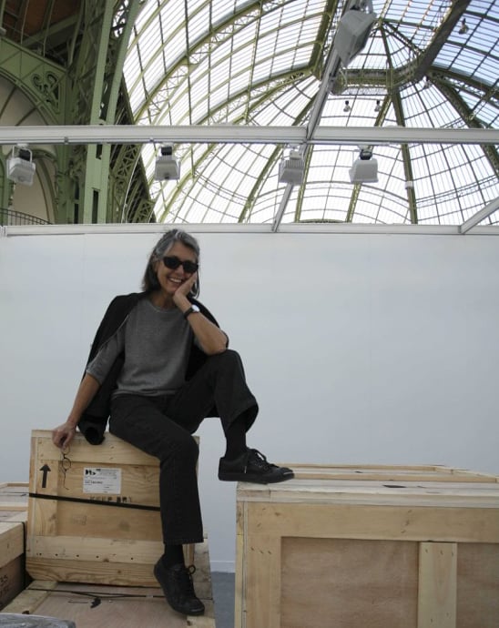 Paula Cooper taking a break from setting up her booth at FIAC, Paris (2007). Photo: Vincent Capman, SIPA. 