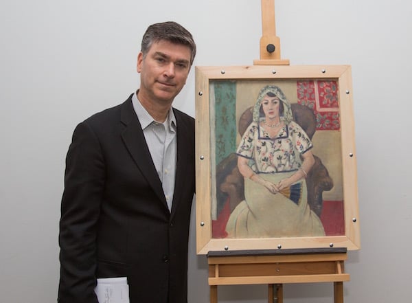 Rosenberg family Christopher Marinello posing with the restituted painting Photo: The Art Recovery Group