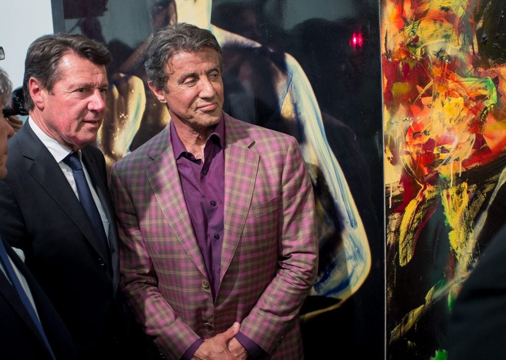 Sylvester Stallone and Christian Estrosi mayor of Nice (left) attend the opening of the actors's art exhibition 