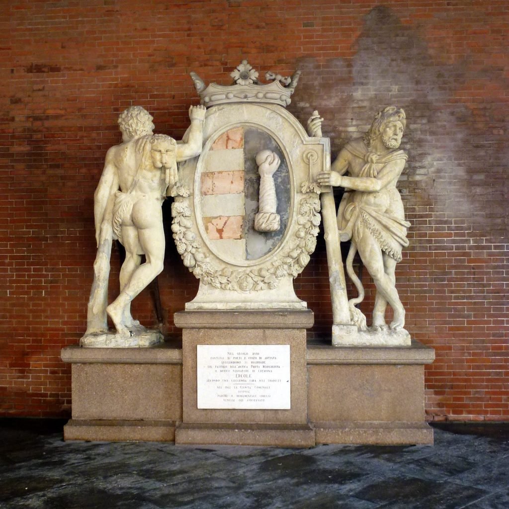 The Statue of the Two Hercules, a marble and stone statue of two figures of Hercules flanking a large shield.