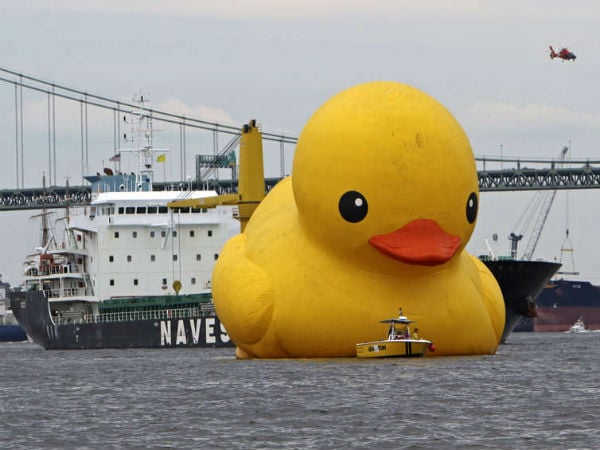 A tugboat comes to the aid of the Tall Ships rubber duck.  Photo: Joseph Kaczmarek/ Inquirer