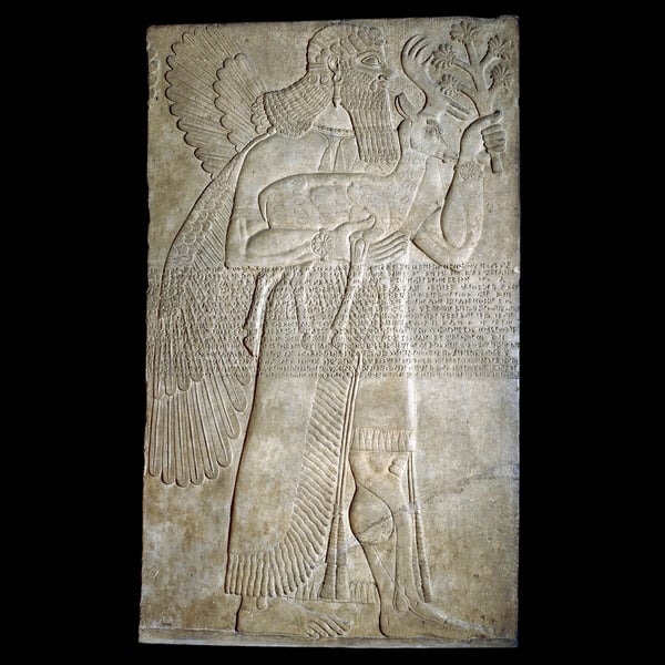 Assyrian stone panel from the palace of Ashurnasirpal II in Nimrod<br>Photo via: British Museum
