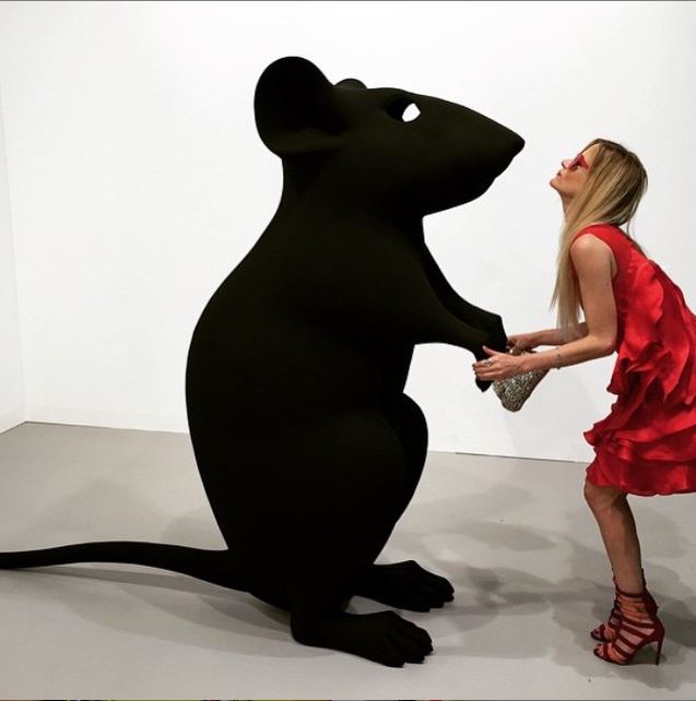 Stacey Engman poses with a Katharina Fritsch's Hohle Maus/Hollow Mouse at Matthew Marks Gallery's booth at Art Basel. Photo: Instagram/@artbinder