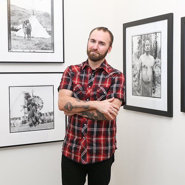 Hunter Barnes with his work at the Edition Hotel in New York.  Photo: Aria Isadora, courtesy of BFA.