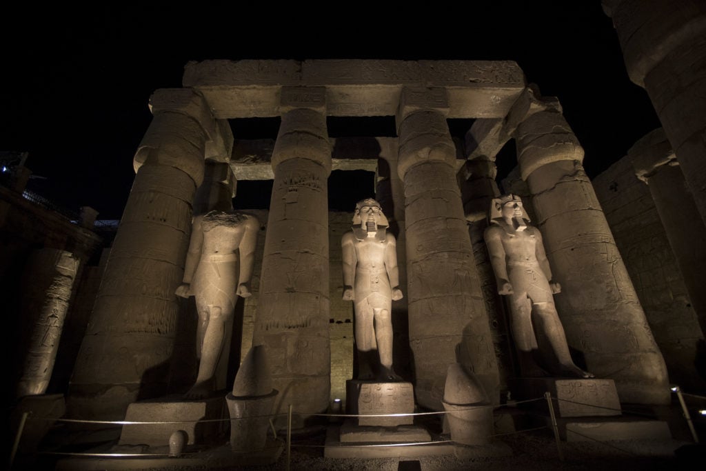 The illuminated statues during a light show at the Luxor Temple in Luxor, Upper Egypt. Photo by Gehad Hamdy/picture alliance with Getty Images.