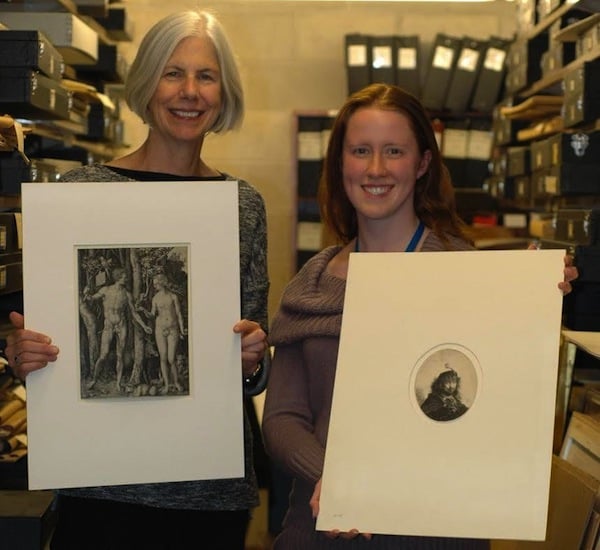 Former library President Amy Ryan and Conservation Officer Lauren Schott hold the misfiled prints. <br>Photo: via Boston Public Library</br> 