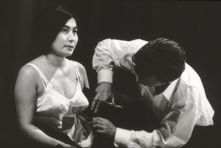 Yoko Ono performs Cut Piece in 1966.