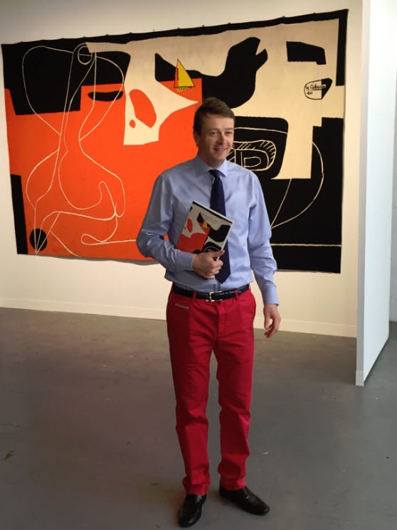 Frederik Bruun Rasmussen in front of Le Corbusier’s tapestry at Collective Design 2015 