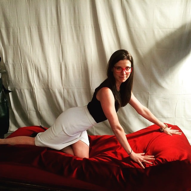 A fan recreates George Costanza's "art of seduction" pose at Hulu's pop-up <em>Seinfeld</em> museum. Photo: Eliza Leary, via Instagram. 