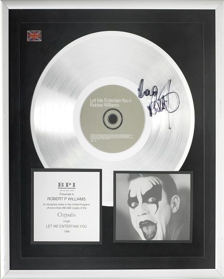 A Platinum Award for the single "Let Me Entertain You", UK, 1998 Photo: Bonhams