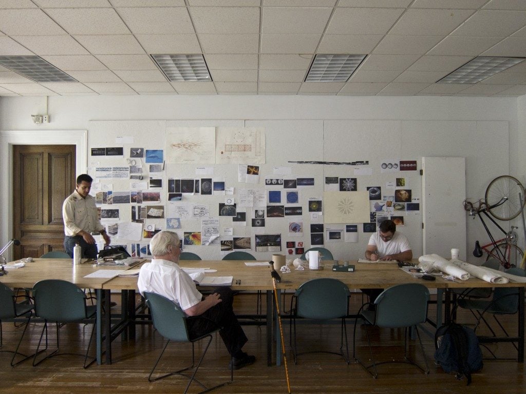 Lowry Burgess (center) in the Moon Arts "war room." Courtesy of the Moon Arts Project.