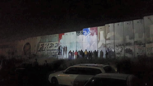 By nightfall the mural was already whitewashed by angry locals Photo: Fadi Arouri via Facebook