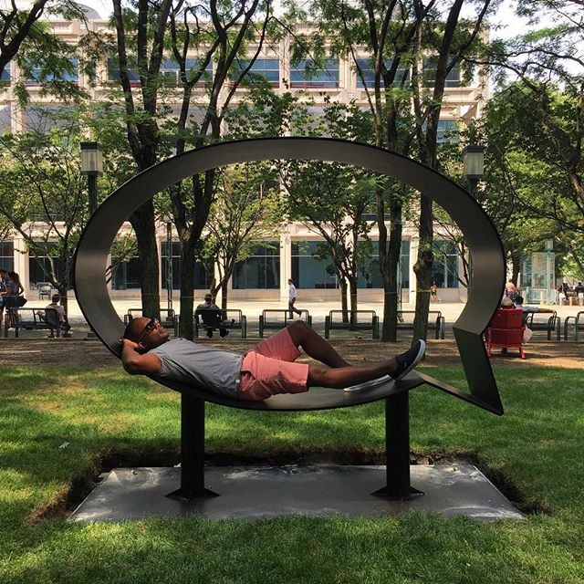 Hank Willis Thomas sitting in one of his sculptures in the Public Art Fund's "The Truth Is I See You." Photo: Hank Willis Thomas, via Instagram.
