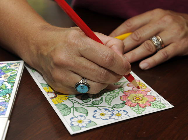 Coloring a postcard by adult coloring book queen Johanna Basford. Photo: Susan Tripp Pollard, courtesy Bay Area News Group.