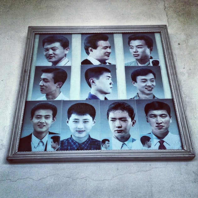 David Guttenfelder, <em>Example haircuts on display at a barbershop in #Pyongyang</em> (2013). Photo: David Guttenfelder, via Instagram, courtesy AP Photo.