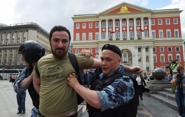 Russian police detaining Orthodox activist Dmitry Enteo during an unauthorized rally in central Moscow in May 2015Photo: Dmitry Serebryakov via Yahoo News