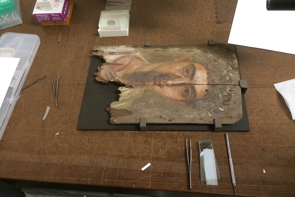 A Roman-era Egyptian mummy portrait, shown in natural light shows no traces of the blue pigments underneath.  Photo: Phoebe A. Hearst Museum of Anthropology, University of California, Berkeley.