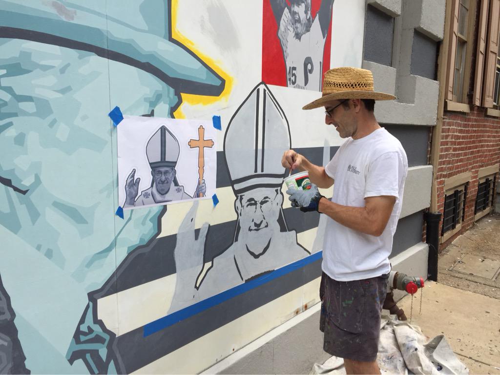 Pope Francis being added to the mural of Franks at Philadelphia bar Dirty Franks. Photo: Lauren Vidas, via Twitter.