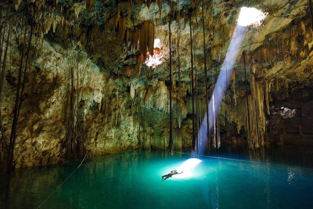 John Stanmeyer, VII, Mexico, 2009. The Maya believed natural wells, such as the Xkeken cenote in Mexico’s Yucatán, led to the underworld. Water flows through human existence, scribing a line between life and death. Photo: John Stanmeyer, VII.