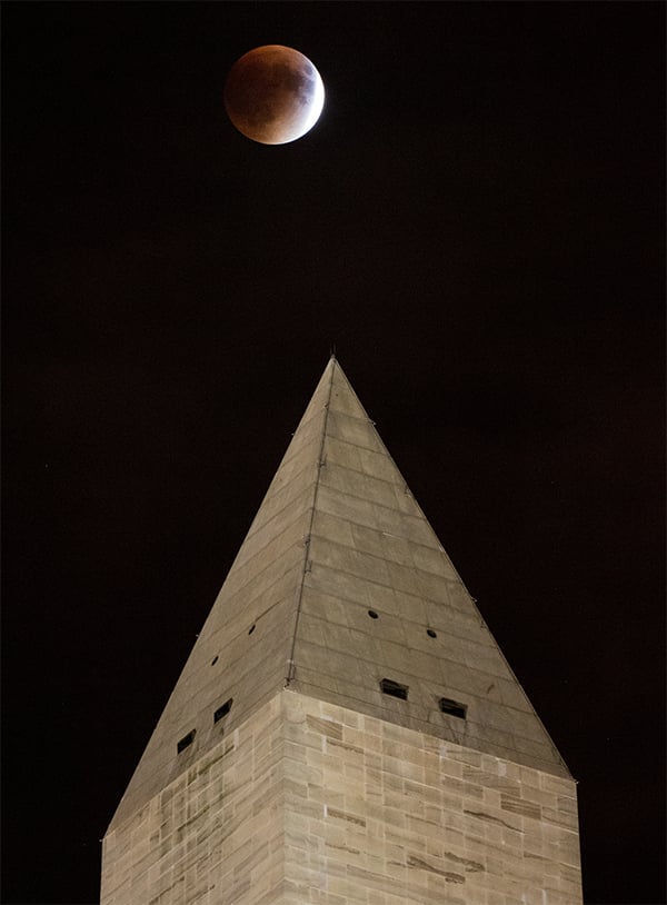 The blood moon over the Washington Monument in Washington, DC. Photo: NASA/Aubrey Gemignani.