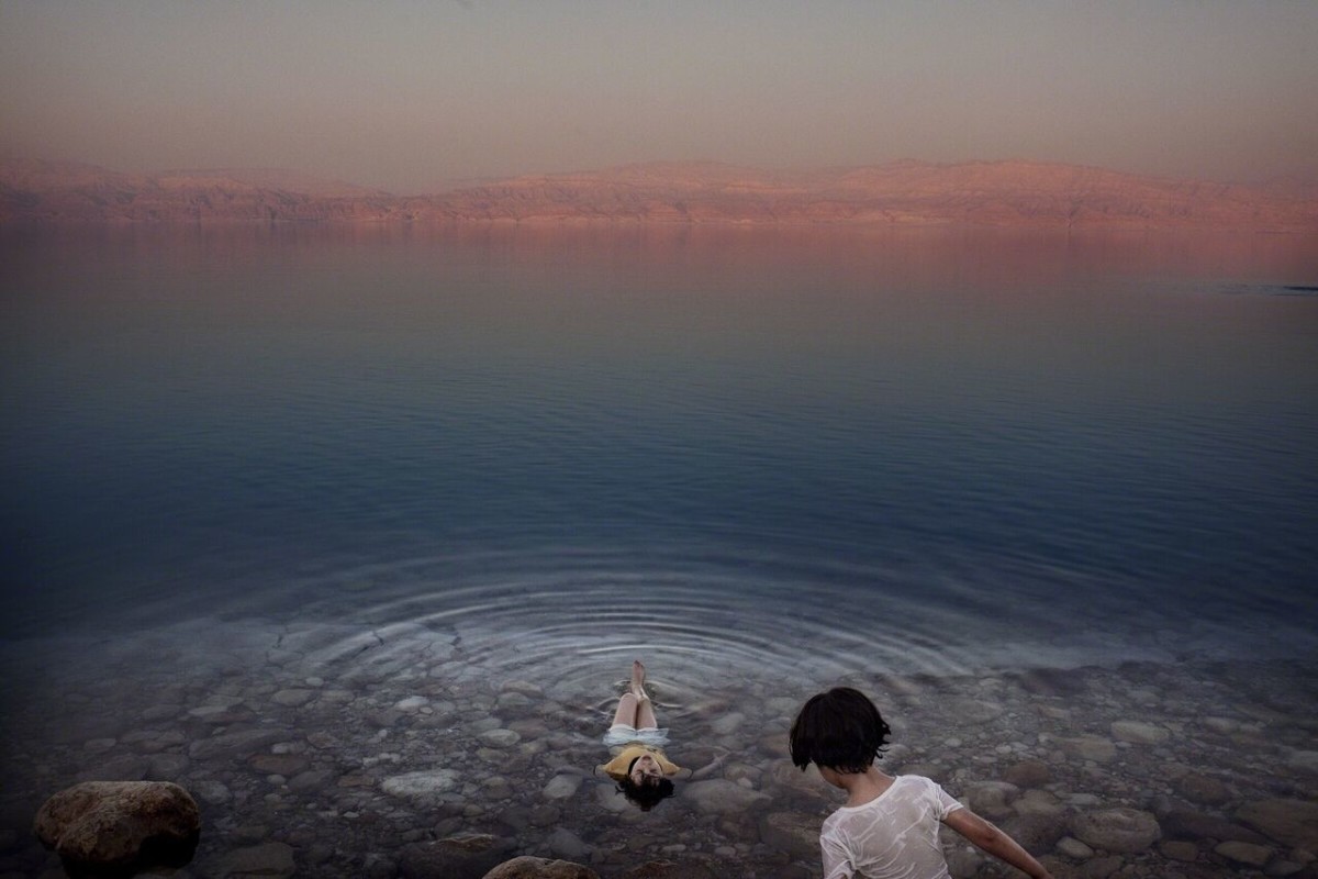 Paolo Pellegrin, Israel, 2009. Girls from a West Bank village cool off in the briny waters of the Dead Sea, the world’s deepest saltwater lake. Naturally buoyant waters make it a favorite of bathers. Yet levels are dropping more than three feet a year. Photo: Paolo Pellegrin, Magnum Photos.