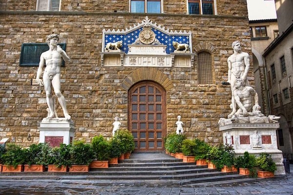 Sculptures of David and Hercules killing Cacus outside the Palazzo Vecchio, Florence. Photo: caftours.com