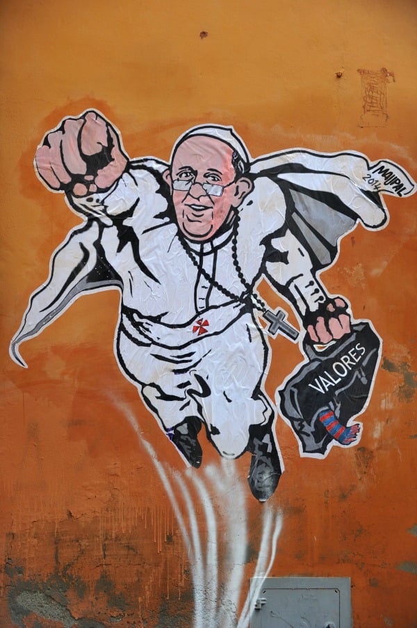 Mauro Pallotta's Roman street art mural showing Pope Francis as a super hero. <br>Photo: Tiziana Fabi, AFP/Getty Images.