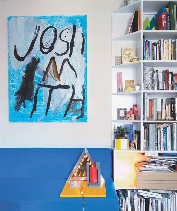 Tauba Auerbach's living room, where a painting by Josh Smith hangs. 