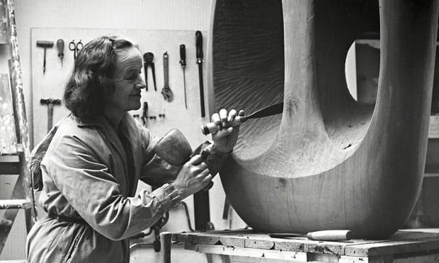 Barbara Hepworth with unfinished wood carving Hollow Form with White Interior (1963).Photo: Val Wilmer /Hepworth Estate