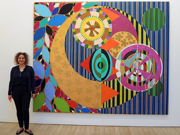 Beatriz Milhazes, with her painting <em>Marcujola</em> (2015) at James Cohan gallery. Photo: Sarah Cascone.