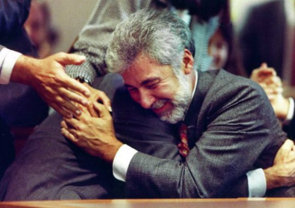 Dennis Barrie hugs his attorney H. Louis Sirkin after hearing the verdict in 1990.<br>Photo: via Box Turtle Bulletin