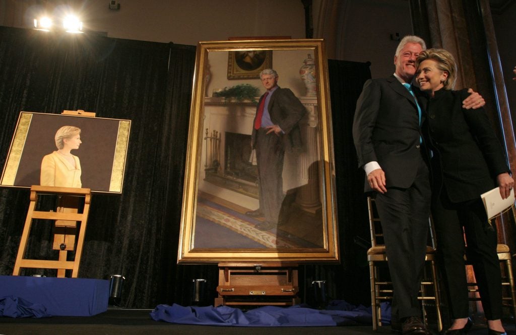 President Bill Clinton and Senator Hillary Clinton (D-NY) unveil their portraits for the National Portrait Gallery. Photo by Michel Du Cille for the <em>Washington Post</em> via Getty Images.
