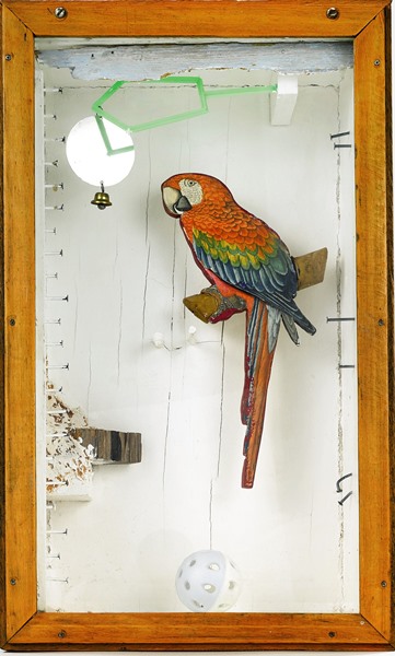 Joseph Cornell, <i>Untitled (Aviary Series, Parrot With Toy Bell)</i>, ca. 1953-54, wood and glass box construction with found objects.<br>Photo courtesy Sotheby’s. 