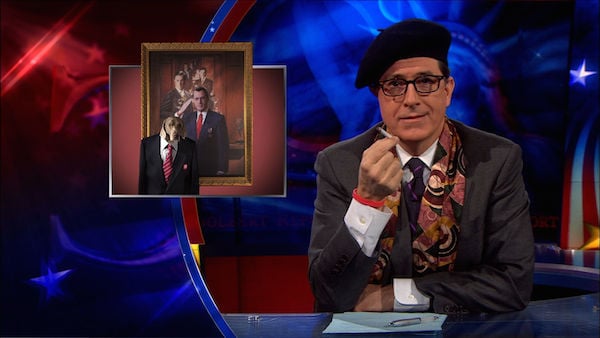 Stephen Colbert with a graphic of William Wegman's version of a painting of him