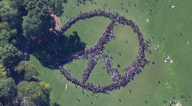 Yoko Ono's attempt at the largest peace sign formed with humans.Photo via Pitchfork.