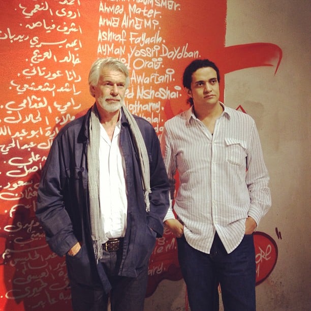 Ashraf Fayadh with a man at an art opening during Jeddah art week. Photo: Ashraf Fayadh, via Instagram.