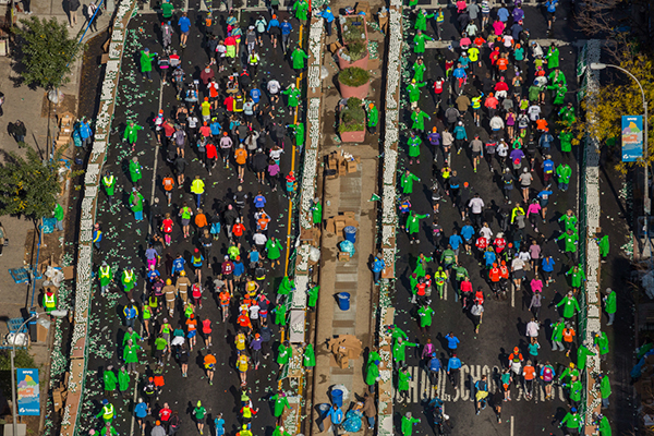 George Steinmetz, "New York Air." Runners take cups of water from volunteers along 4th Avenue in Brooklyn. The New York Road Runners, which produces the marathon, stocked 2.3 million paper cups for the event. Photo: George Steinmetz, courtesy Anastasia Photo.