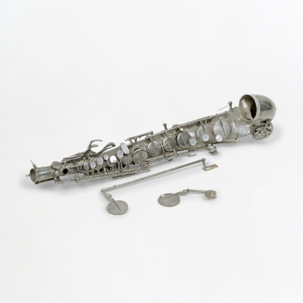 Alto Saxaphone (ruin) Brass silvered. Salvaged from the Alte Münz bunker, Berlin, 1945 <br>Photo: Collection Musikinstrumenten-Museum Berlin