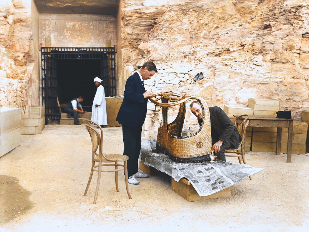 Harry Burton, conservators Arthur Mace and Alfred Lucas work on a golden chariot from King Tut's tomb outside a makeshift laboratory in the tomb of Sethos II. Photo: courtesy the Griffith Institute, colorization by Dynamichrome.