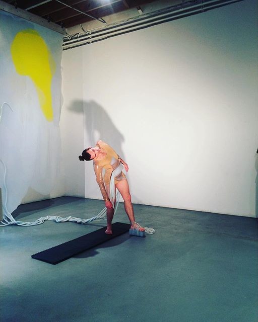 Silas Riener performing at Locust Projects with sculptures from Martha Friedmans "Pore." Photo: Neha Jambhekar.